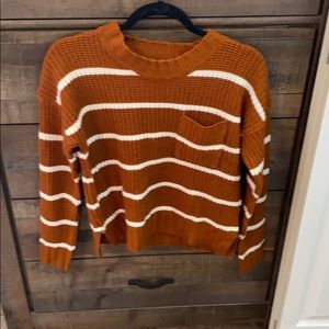 Orange and white striped sweater